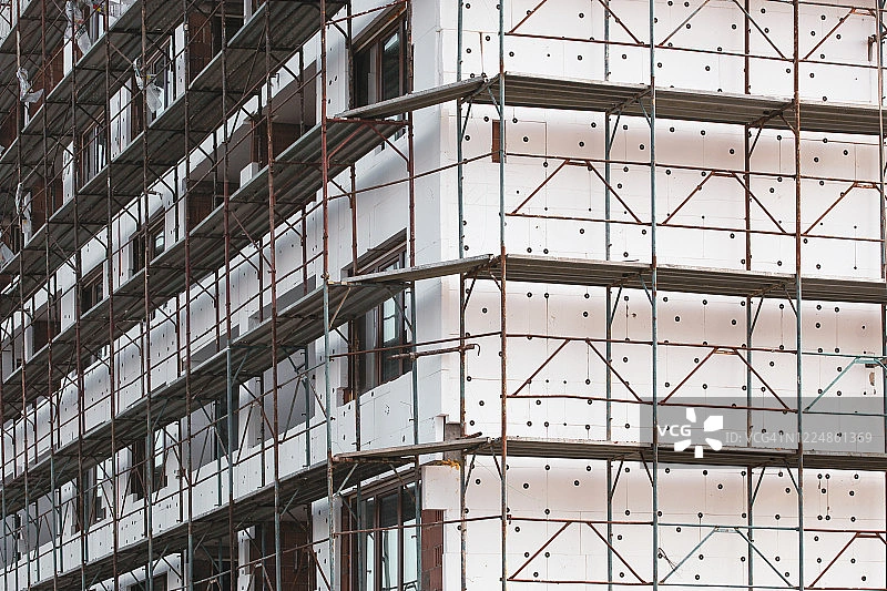 Building Under Construction with EPS Insulation Panels Installed on Exterior Walls